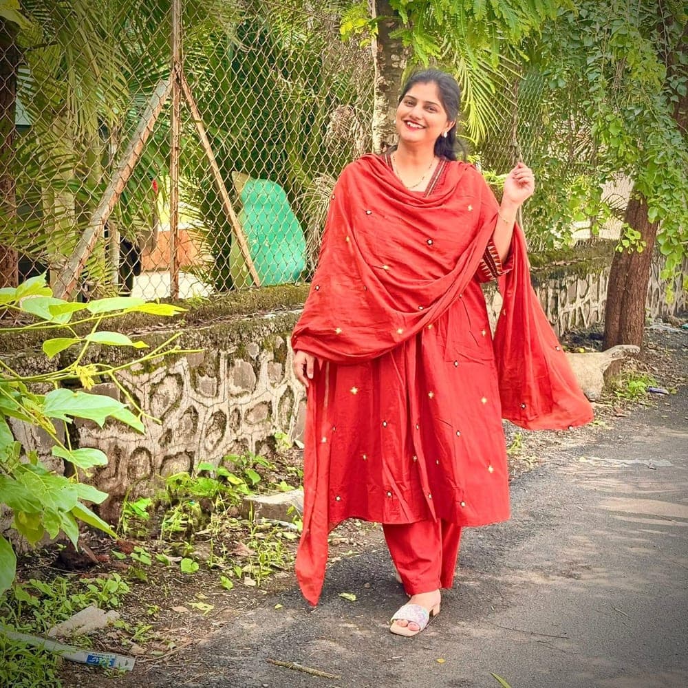 Mohini in a red mirror-work suit